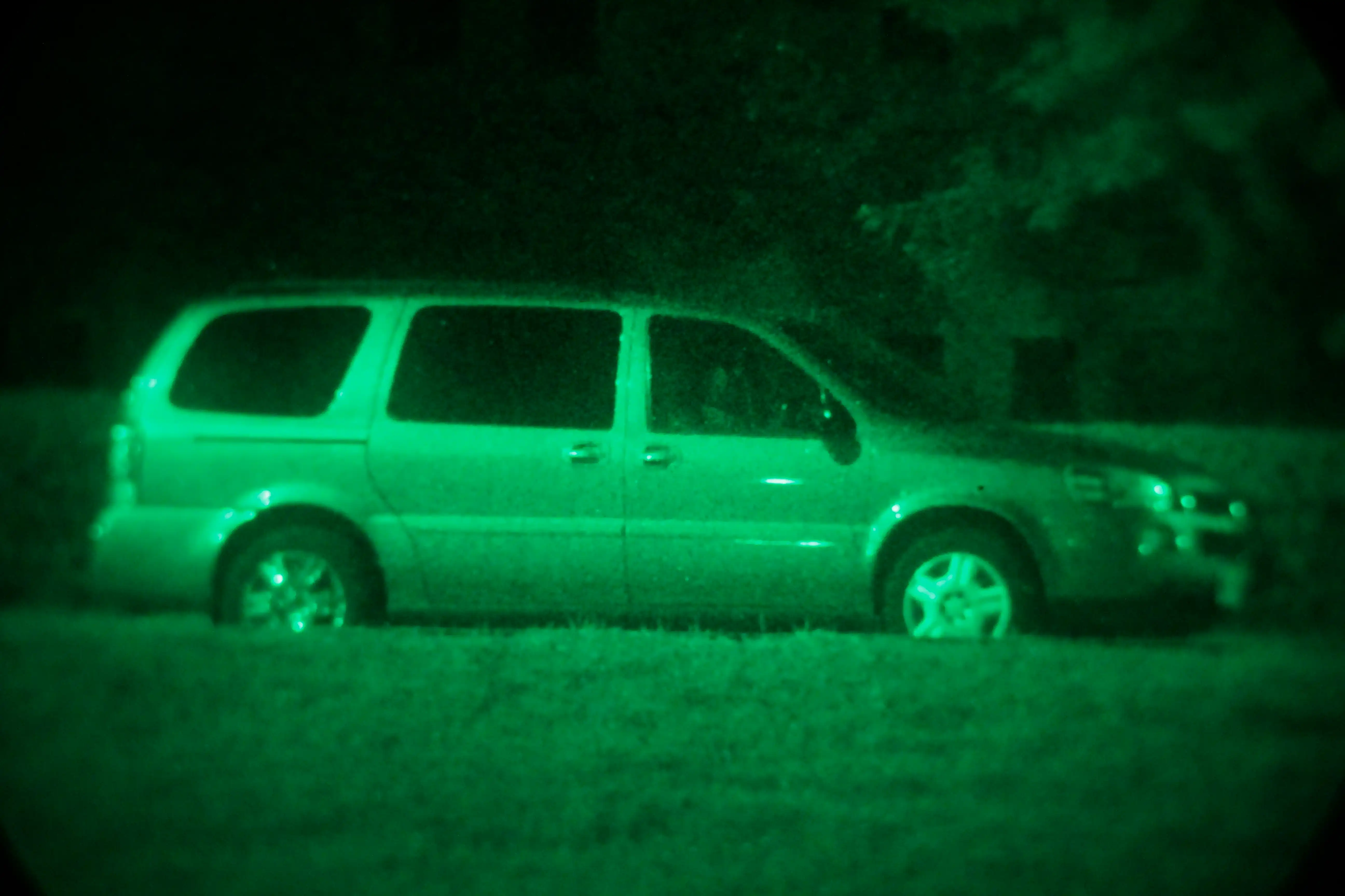 picture of a van taken at night with night vision enhancement